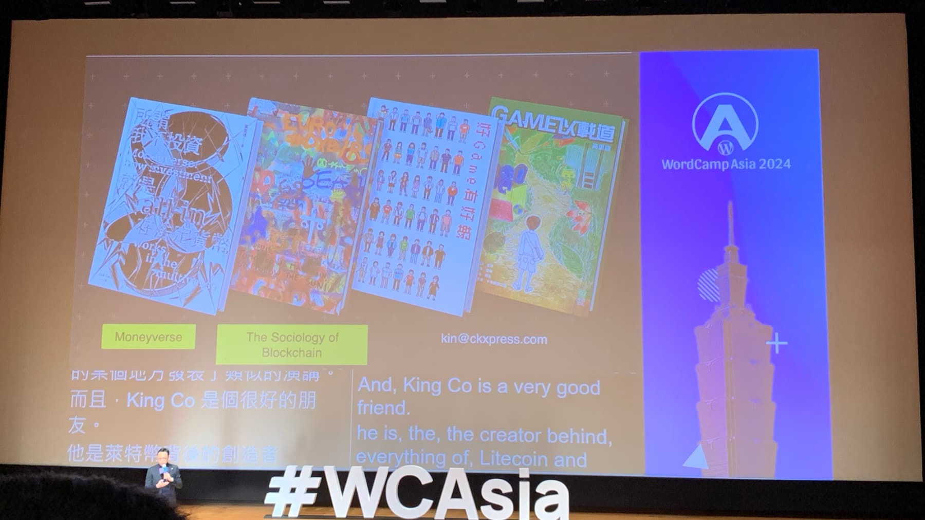 A WordCamp Asia 2024 slide showing manga covers and blockchain-related labels, with bilingual captions projected below.